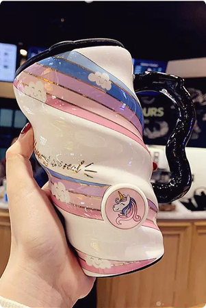 Customer holding a floral insulated tumbler